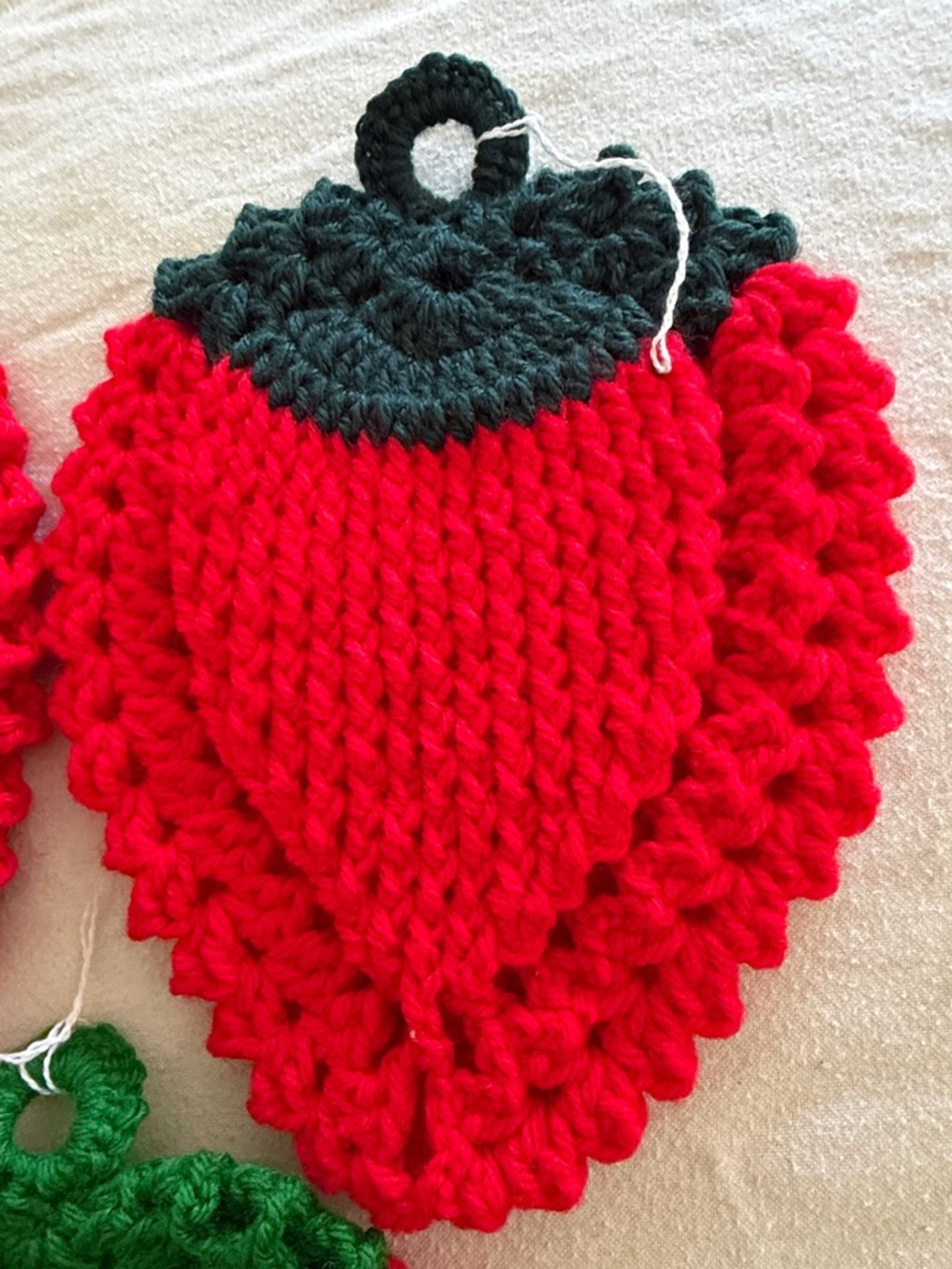 Three Handmade Red Crochet Strawberry Pot Holders with Green Tops - Picture 4 of 5